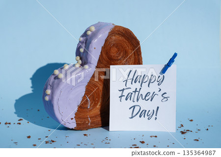 Happy Father's Day saying caption on greeting card Delicious fresh croissant topped with colorful flavor Ganache. Creation unique heart shape bakery. Puff pastry holiday love gift present idea Happy Father's Day saying caption on greeting card Delicious fresh croissant topped with colorful flavor Ganache. Creation unique heart shape bakery. Puff pastry holiday love gift present idea 135364987