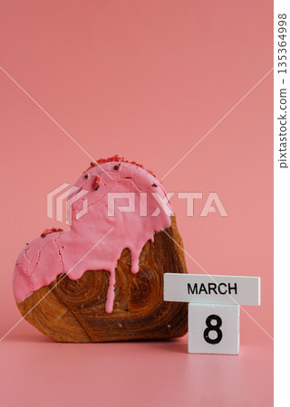 8 march calendar date Women's day Delicious fresh croissant topped with colorful flavor Ganache. Creation unique heart shape bakery. Puff pastry holiday love gift present idea 135364998