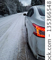 Car on a Snowy Forest Road in Winter 135366548