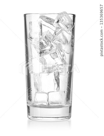 Glass filled with clear ice cubes, reflecting cool refreshment Glass filled with clear ice cubes, reflecting cool refreshment 135369657