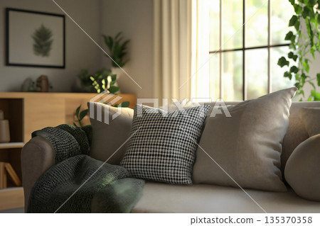 Sunlight streaming through a window illuminates a comfortable sofa adorned with cushions and a blanket Sunlight streaming through a window illuminates a comfortable sofa adorned with cushions and a blanket 135370358