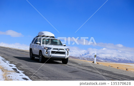 Toyota 4runner running on high altitude trail in Tibet ,China Toyota 4runner running on high altitude trail in Tibet ,China 135370628