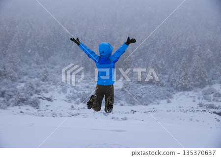 Asian woman enjoy the beautiful snowing landscape Asian woman enjoy the beautiful snowing landscape 135370637