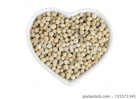 White peppercorns or pepper in ceramic bowl isolated on white background. Top view. Flat lay 135371345