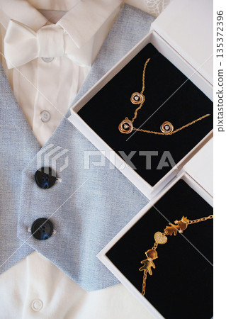 Jewelry and vest set for formal occasion preparation Jewelry and vest set for formal occasion preparation 135372396