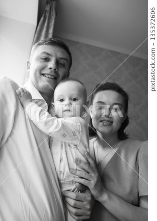 Family portrait showcasing joy and love at home Family portrait showcasing joy and love at home 135372606