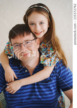 Father and daughter share a moment indoors Father and daughter share a moment indoors 135372762