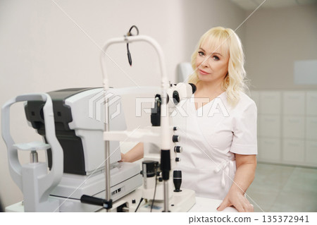 Ophthalmologist at work in a medical office setting Ophthalmologist at work in a medical office setting 135372941