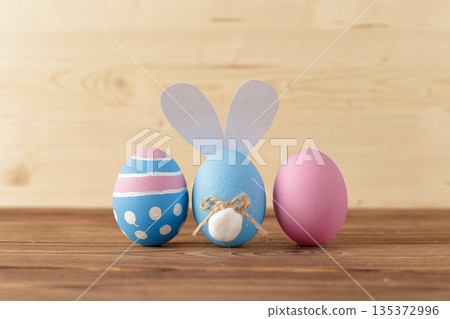 Colorful eggs and bunny decoration for Easter celebration on wooden table 135372996