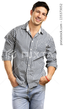 Young man smiles and poses with hands in pockets while wearing casual clothes Young man smiles and poses with hands in pockets while wearing casual clothes 135373052