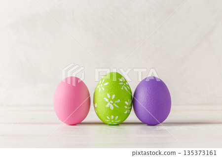 Colorful eggs display on a plain surface during spring holiday preparations 135373161