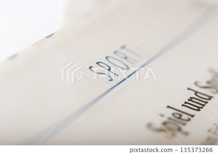 Document with the word sport written across the top in clear blue ink Document with the word sport written across the top in clear blue ink 135373266