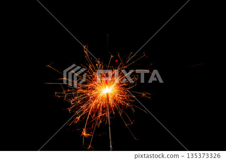 Fireworks sparkler produces bright light at night during celebration event Fireworks sparkler produces bright light at night during celebration event 135373326