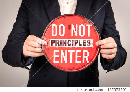 Do Not Enter Principles Concept Sign Held By Business Person In Suit 135373501