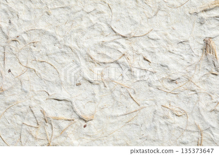 Natural mulberry paper pulp with visible dried leaves and grass 135373647