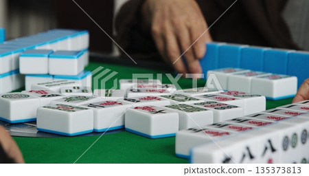 Chengdu, Sichuan, China. Men Playing Mahjong At Automatic Mahjong Table. Friendly Playing. Hands Of Mahjong Players. Asian Culture. Travel China. Chinese Tile-based Game. Live Game, Close Up View 135373813
