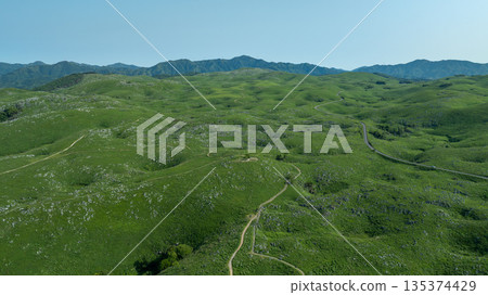 Aerial view of Akiyoshidai in early summer, a vast karst plateau and blue sky 135374429