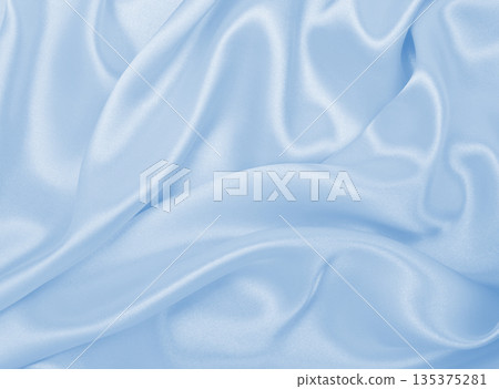 Smooth elegant blue silk or satin luxury cloth texture as abstract background. Luxurious background design 135375281
