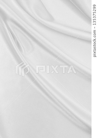Smooth elegant white silk or satin luxury cloth texture as wedding background. Luxurious background design 135375299