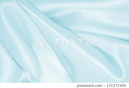 Smooth elegant blue silk or satin luxury cloth texture as abstract background. Luxurious background design Smooth elegant blue silk or satin luxury cloth texture as abstract background. Luxurious background design 135375309