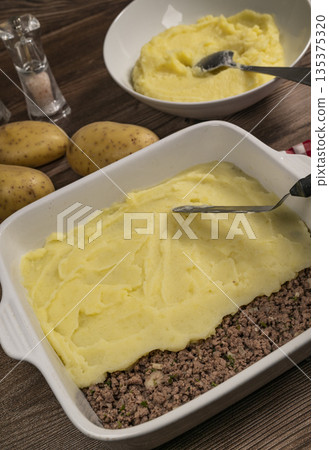 Hachis parmentier, french dish with mashed potato and minced beef 135375320