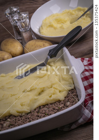Hachis parmentier, french dish with mashed potato and minced beef 135375424