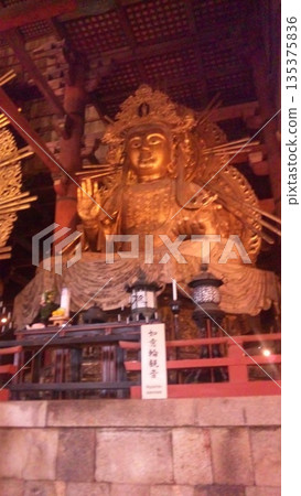 Wooden carved Buddha statue Wooden carved Buddha statue 135375836