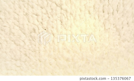 fluffy creamy wool texture closeup soft undulating fibers evoke cozy warmth in natural macro abstract ideal for serene wallpaper or design banner space 135376067