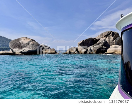 Thailand's Similan Islands, known for their snow-white beaches, crystal clear waters, coral reefs, and rich underwater world Thailand's Similan Islands, known for their snow-white beaches, crystal clear waters, coral reefs, and rich underwater world 135376087