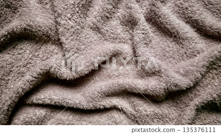 soft fluffy lavender fabric waves in closeup texture evoking serene luxury ideal for calming wallpaper or subtle banner background with ample copy space 135376111