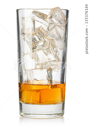Whiskey cocktail with ice cubes in a tall glass Whiskey cocktail with ice cubes in a tall glass 135376184