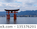 Itsukushima Shrine, a large torii gate standing on the sea 135376201