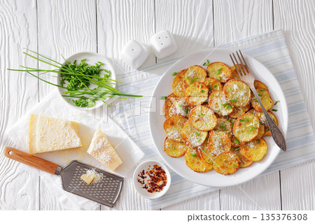 Roasted Potato Slices with Parmesan Cheese Top View 135376308