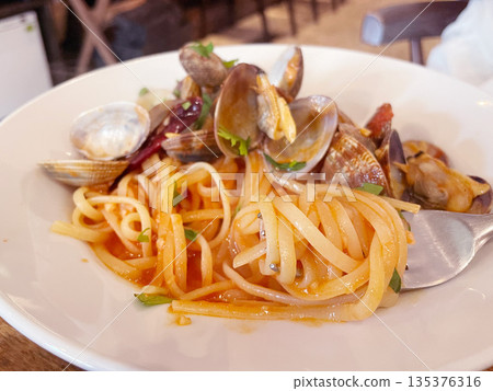 Pasta with clams and tomato sauce Pasta with clams and tomato sauce 135376316