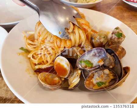 Pasta with clams and tomato sauce Pasta with clams and tomato sauce 135376318