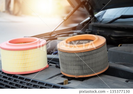 The engine air filter is sitting there, waiting to be replaced. The engine air filter is sitting there, waiting to be replaced. 135377130