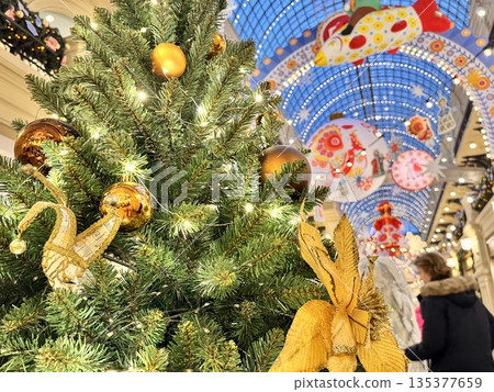 Bright Christmas Tree toys are hanging on the tree. New Year. High quality photo 135377659
