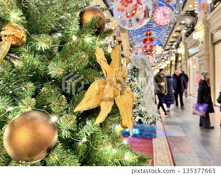 Bright Christmas Tree toys are hanging on the tree. New Year. High quality photo 135377665