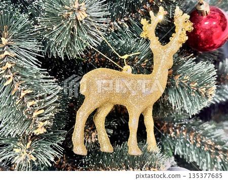 Bright Christmas Tree toys are hanging on the tree 135377685