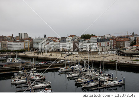 Explore the View of the Boats in the Marina and Cityscape of La Caruna Spain 135378142