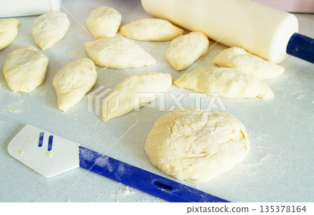 dough, rolling pin, flour for making fresh homemade cakes 135378164
