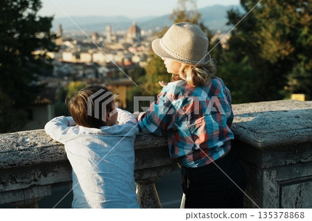 Children Enjoying Cityscape View from Terrace Children Enjoying Cityscape View from Terrace 135378868