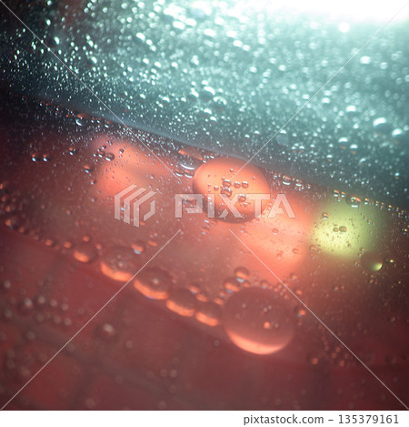 Ethereal Coral And Teal Oil Droplets Floating In Darkness 135379161