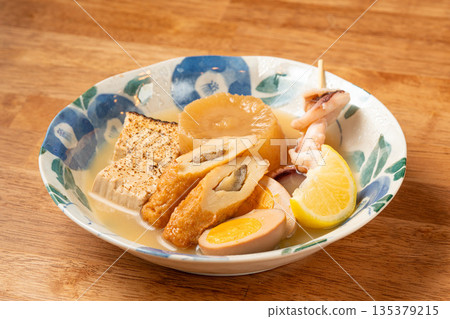Assorted oden - a classic dish at a Japanese izakaya, steeped in dashi broth Assorted oden - a classic dish at a Japanese izakaya, steeped in dashi broth 135379215
