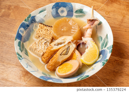 Assorted oden - a classic dish at a Japanese izakaya, steeped in dashi broth 135379224