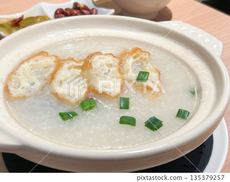 Porridge with century egg and pork 135379257