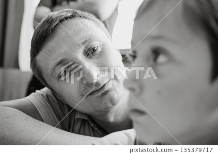 Father Admiring His Son in Black and White Portrait 135379717