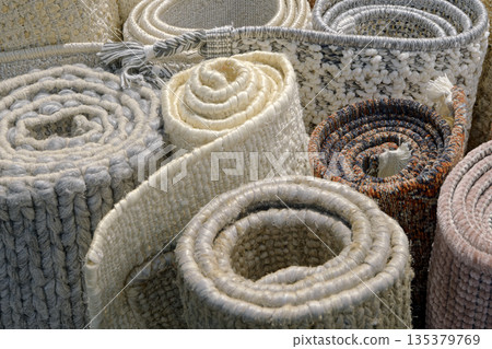 Group of assorted carpets and rugs of various sizes and colors, rolled Group of assorted carpets and rugs of various sizes and colors, rolled 135379769