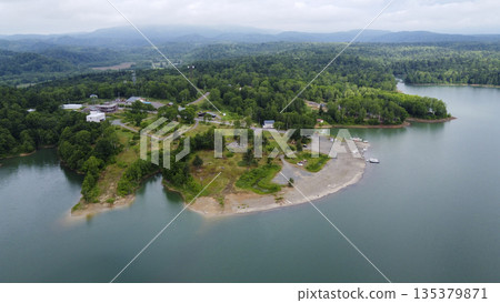 Drone aerial view of the lakeside peninsula and boat launch 135379871