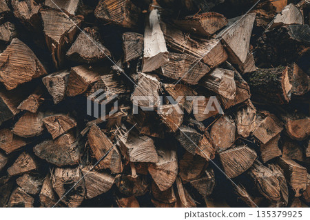 Stacked firewood wood texture background 135379925
